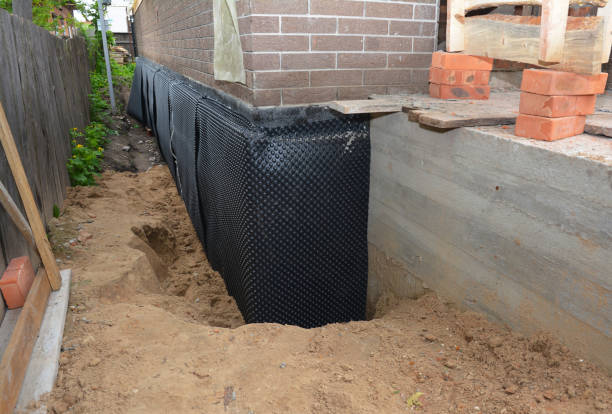 SJ Waterproofing Pros technician performing targeted Wet Basement Repair assessment in Nashville, IL